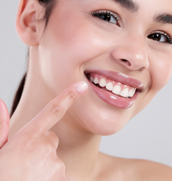Smiling woman outside with healthy teeth